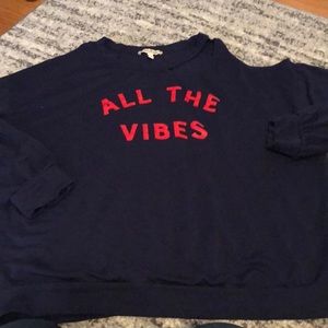 Sweater with shoulder cutout